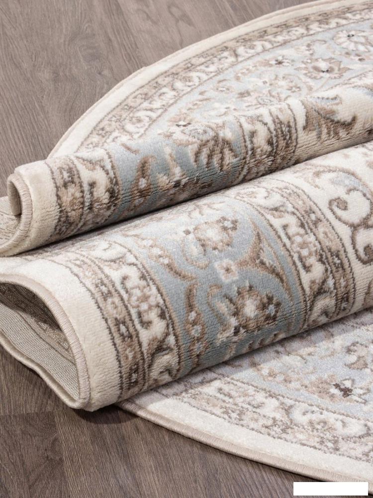 Ковер для жилой комнаты Merinos Valencia Deluxe F014-OVAL-CREAM-L.BLUE (1.5х2.3)
