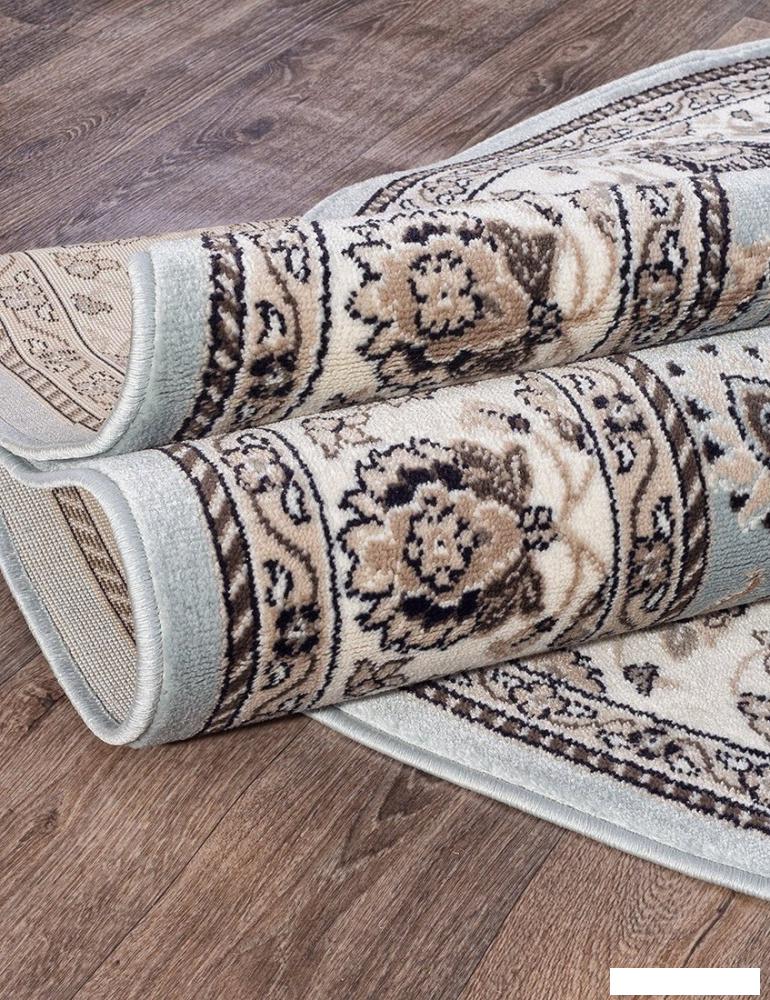 Ковер для жилой комнаты Merinos Valencia Deluxe d251-OVAL-L.BLUE-BROWN (1.5х3)